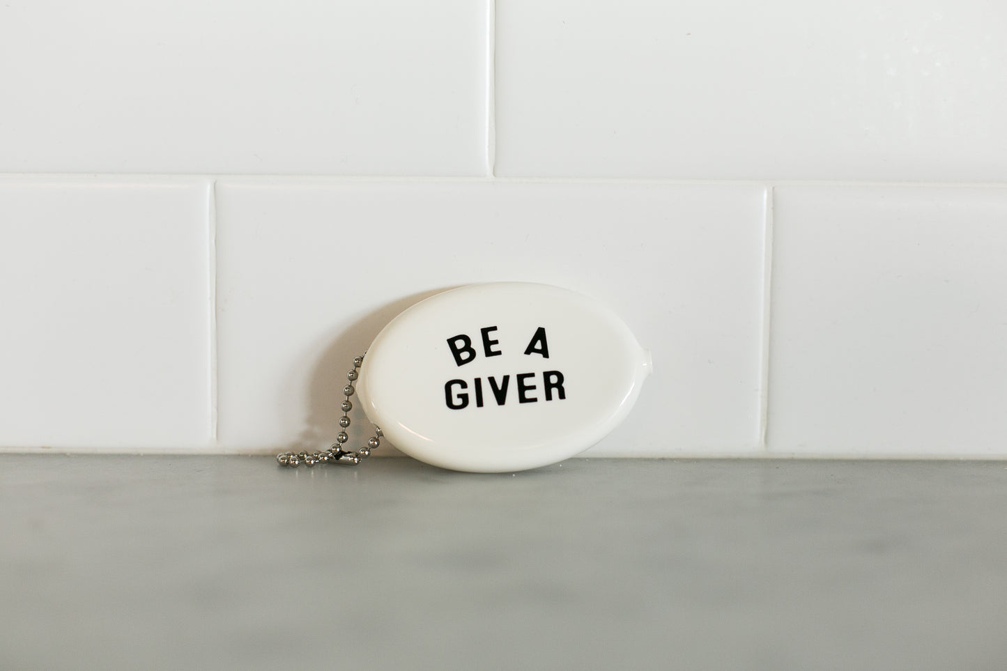 White vintage coin pouch for intentional giving by Modern Burlap