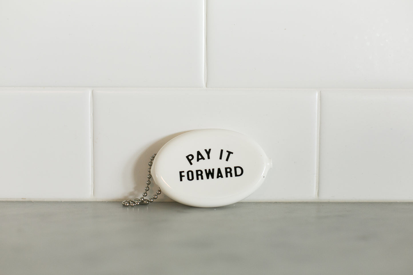 White vintage coin pouch for intentional giving by Modern Burlap