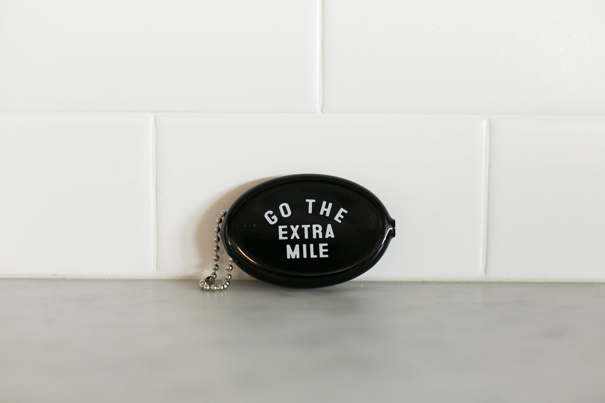 Black vintage coin pouch for intentional giving by Modern Burlap