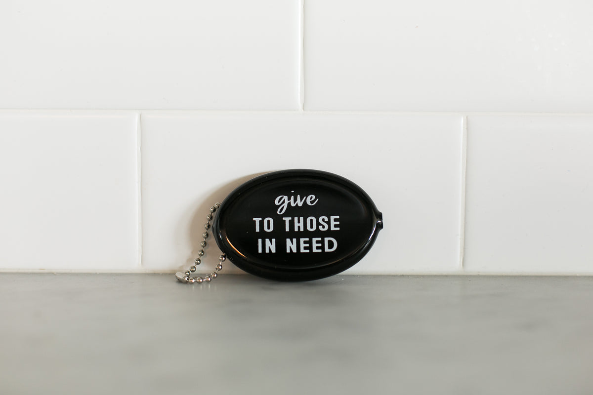 Black vintage coin pouch for intentional giving by Modern Burlap