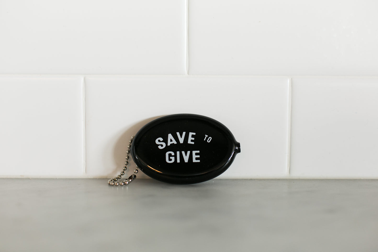 Black vintage coin pouch for intentional giving by Modern Burlap