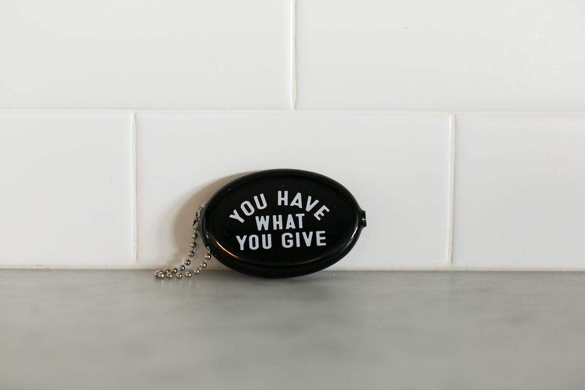 Black vintage coin pouch for intentional giving by Modern Burlap