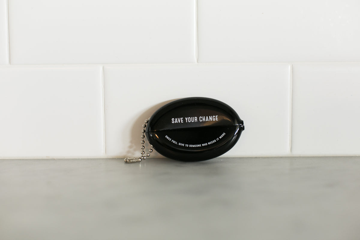 Black vintage coin pouch for intentional giving by Modern Burlap