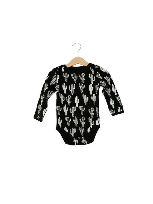 WHITE ON BLACK CACTUS Organic Baby Long Sleeve Bodysuit — product photograph.