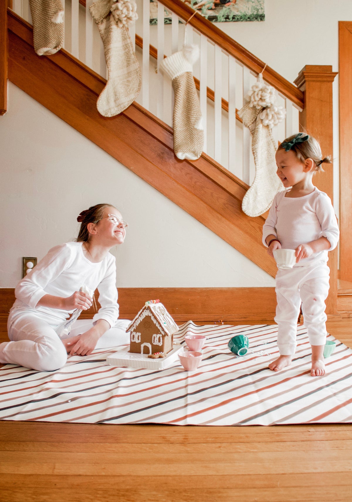 Organic Thermal Baby + Kids Pajama Set | White — Children wearing white pajamas while decorating cookies