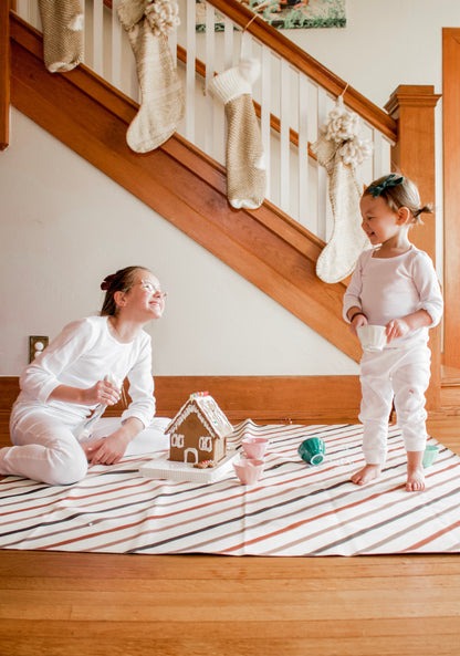 Organic Thermal Baby + Kids Pajama Set | White — Children wearing white pajamas while decorating cookies