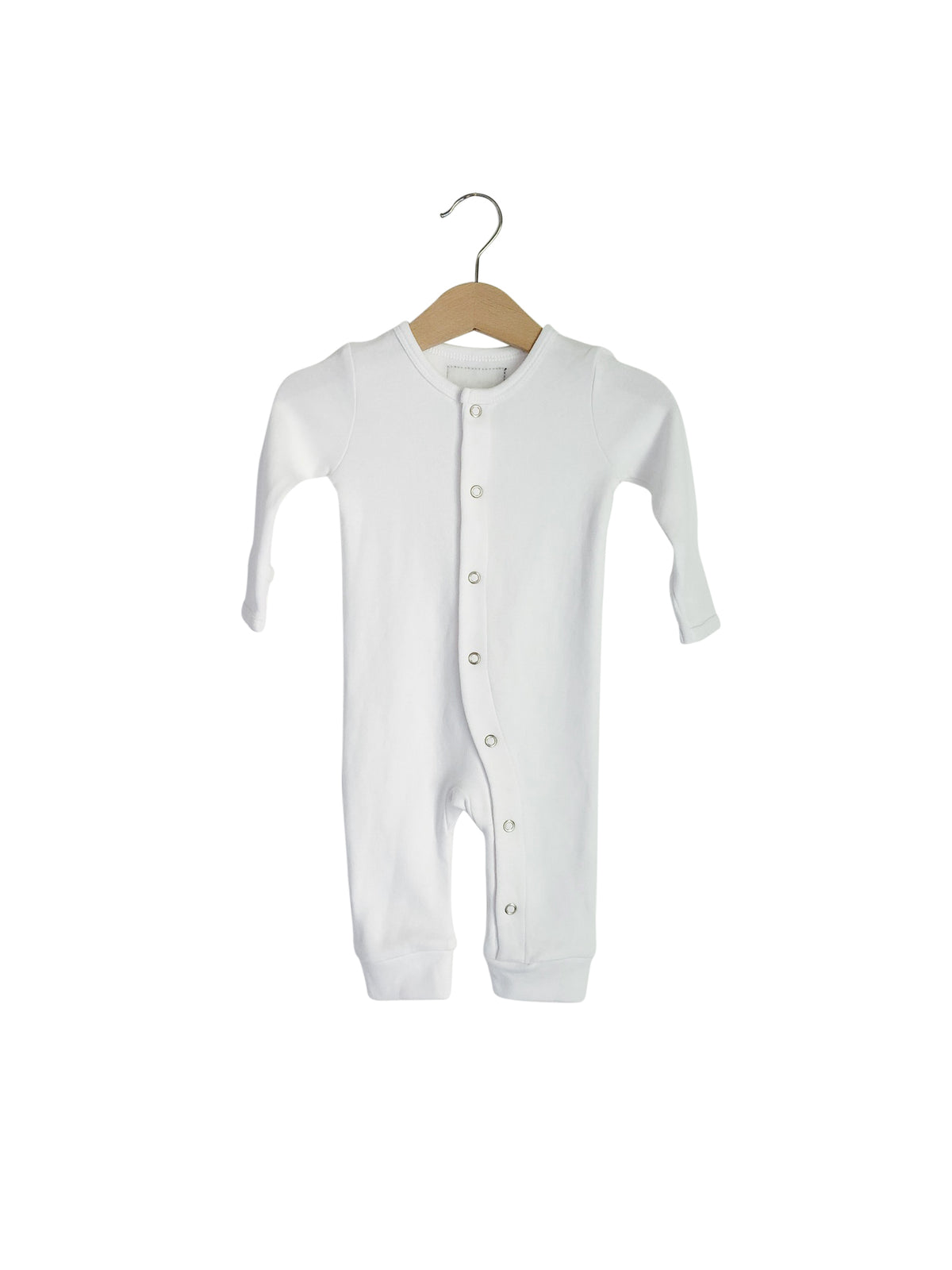 White button coverall on a hanger, showing the front closure and ankle cuffs