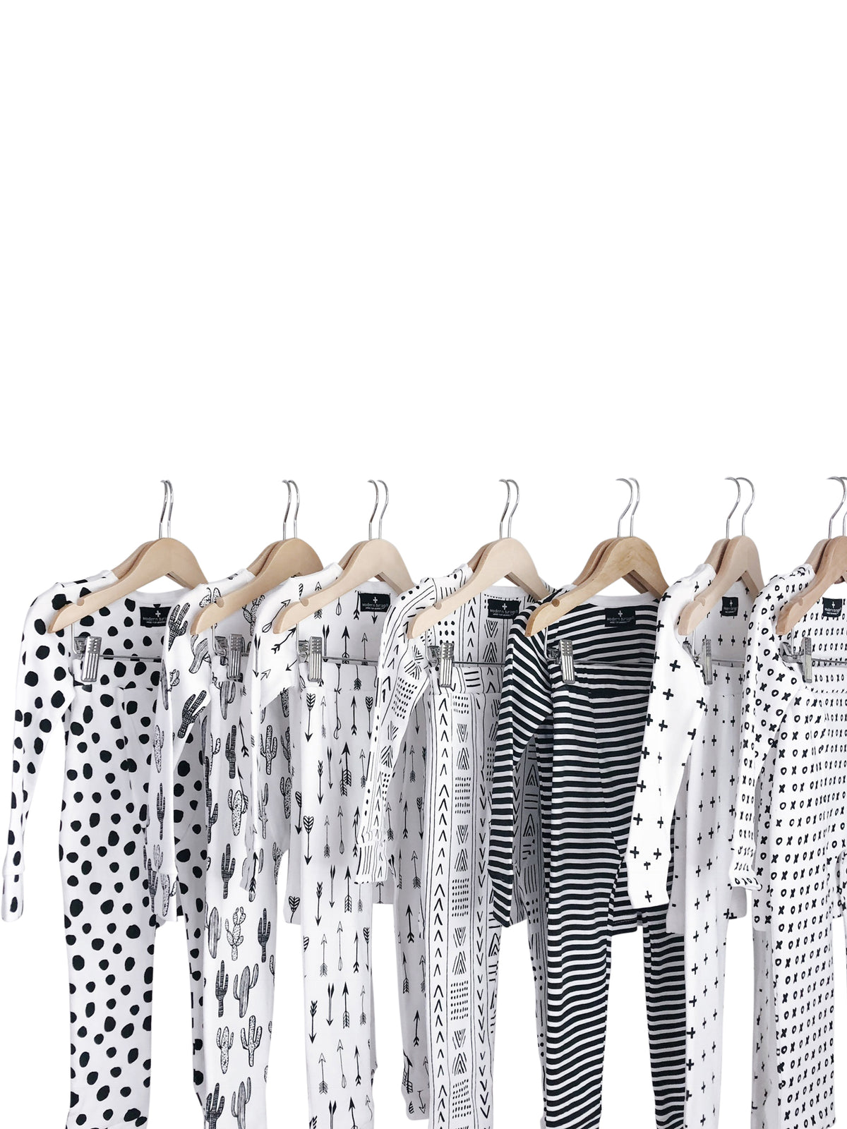Organic Baby + Kids Pajama Set | Signature Prints — Black-and-white printed pajama sets on hangers