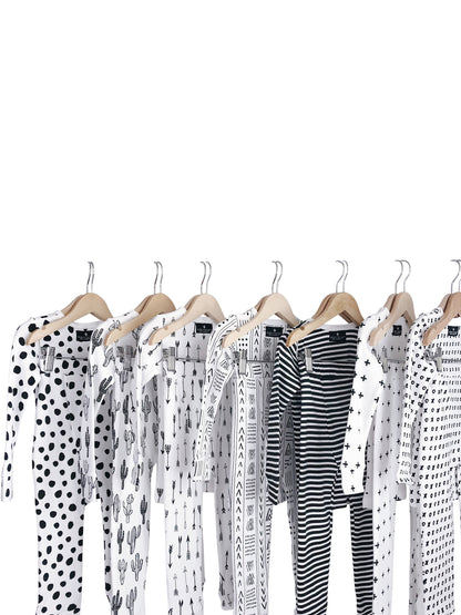 Organic Baby + Kids Pajama Set | Signature Prints — Black-and-white printed pajama sets on hangers