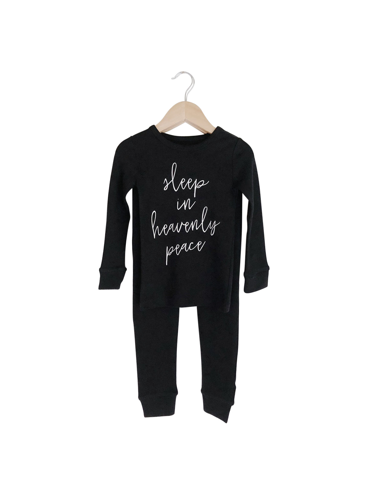 Organic Baby + Kids Pajama Set | Sleep in Heavenly Peace — Black pajama top and matching pants on hangers