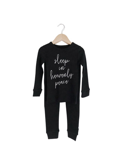 Organic Baby + Kids Pajama Set | Sleep in Heavenly Peace — Black pajama top and matching pants on hangers