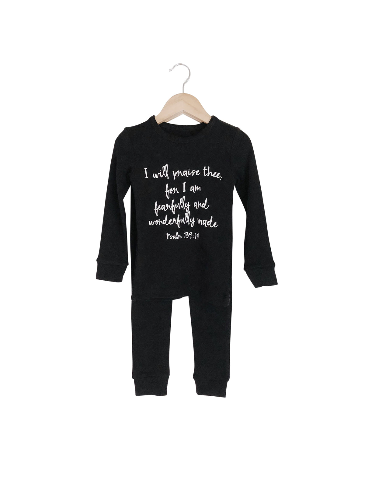 Organic Baby + Kids Pajama Set | Psalm 139:14 — Black pajama top and matching pants on hangers