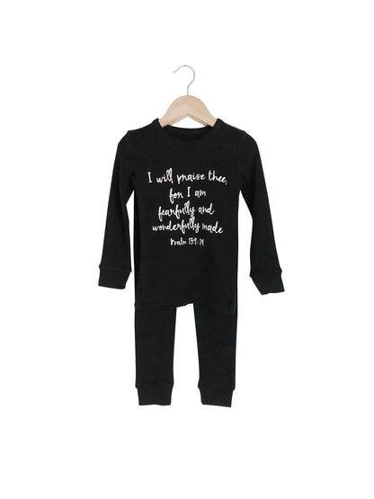 Organic Baby + Kids Pajama Set | Psalm 139:14 — Black pajama top and matching pants on hangers