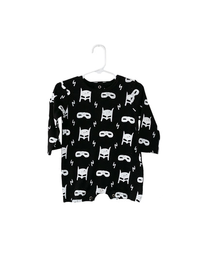 White on Black Hero Struck Organic Baby Long Sleeve Romper — product photograph.