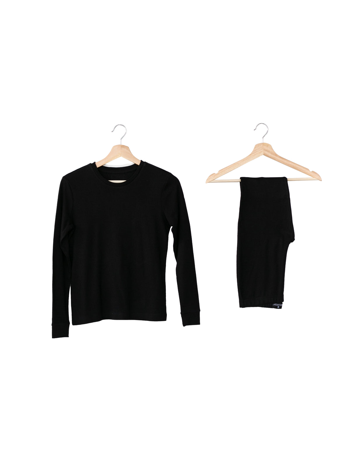 Organic Baby + Kids Pajama Set | Black — Pajama top and matching pants on hangers