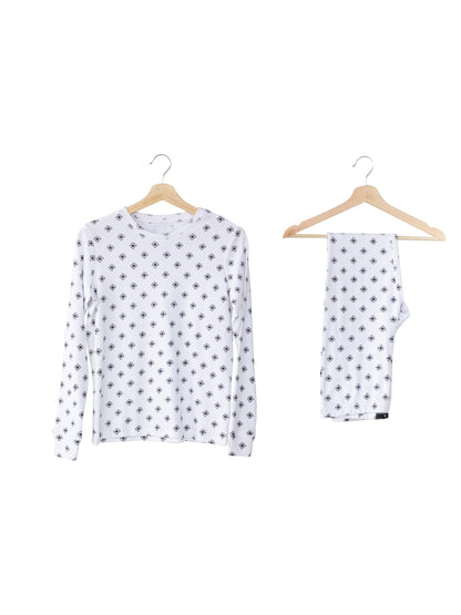 Organic Baby + Kids Pajama Set | Black on White Snowflakes — Printed pajama top and matching pants on hangers