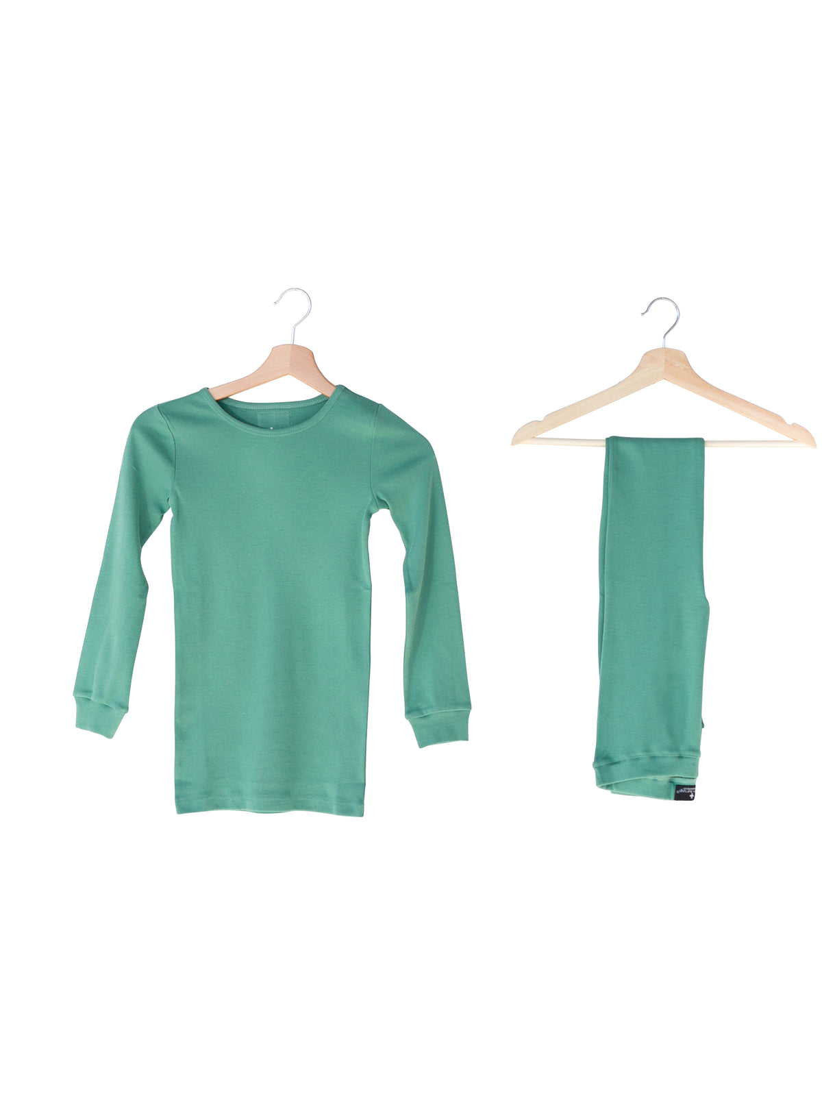 Organic Baby + Kids Pajama Set | Pine Green — Pajama top and matching pants on hangers