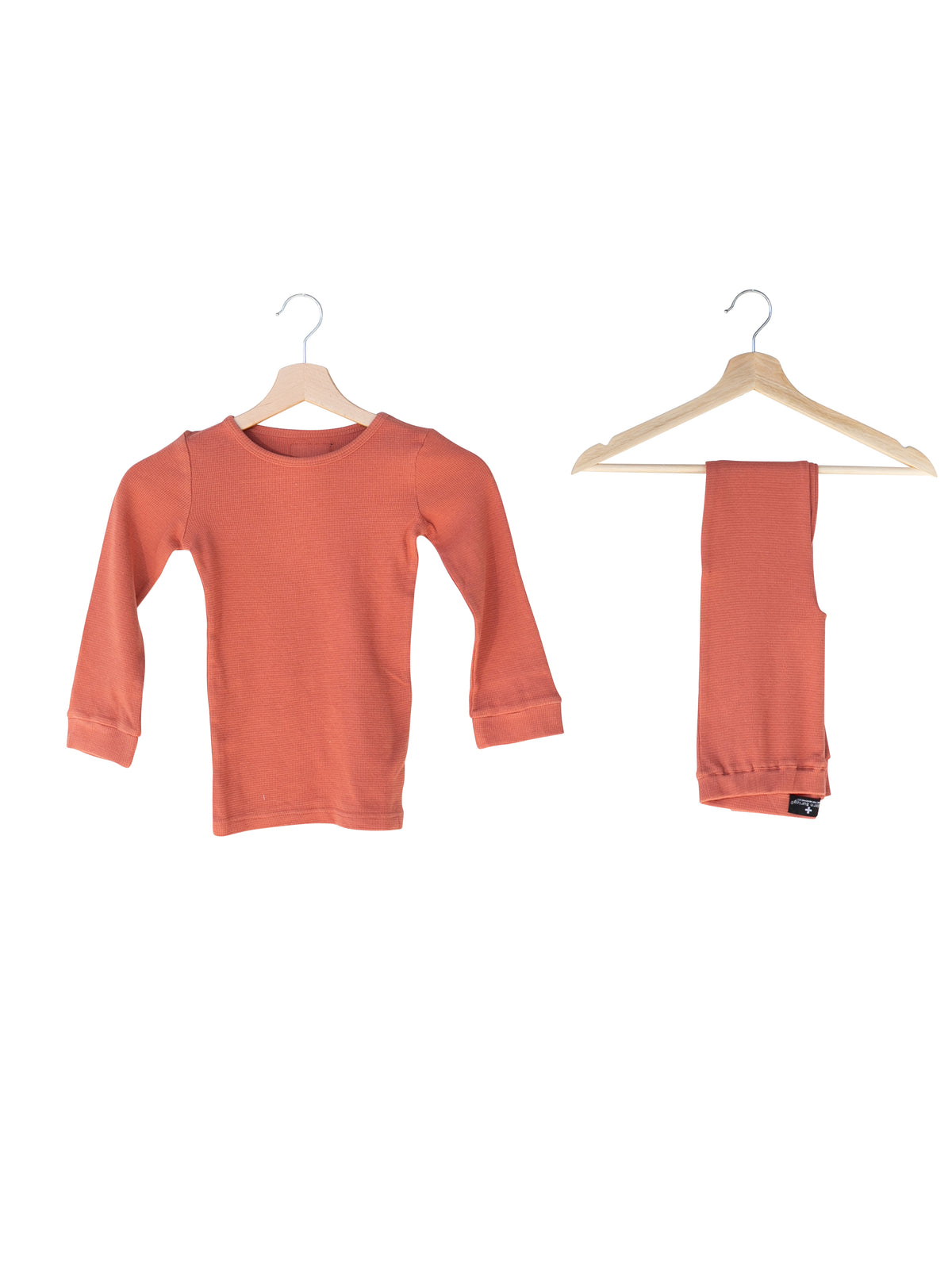 Organic Thermal Baby + Kids Pajama Set | Aragon — Pajama top and matching pants on hangers