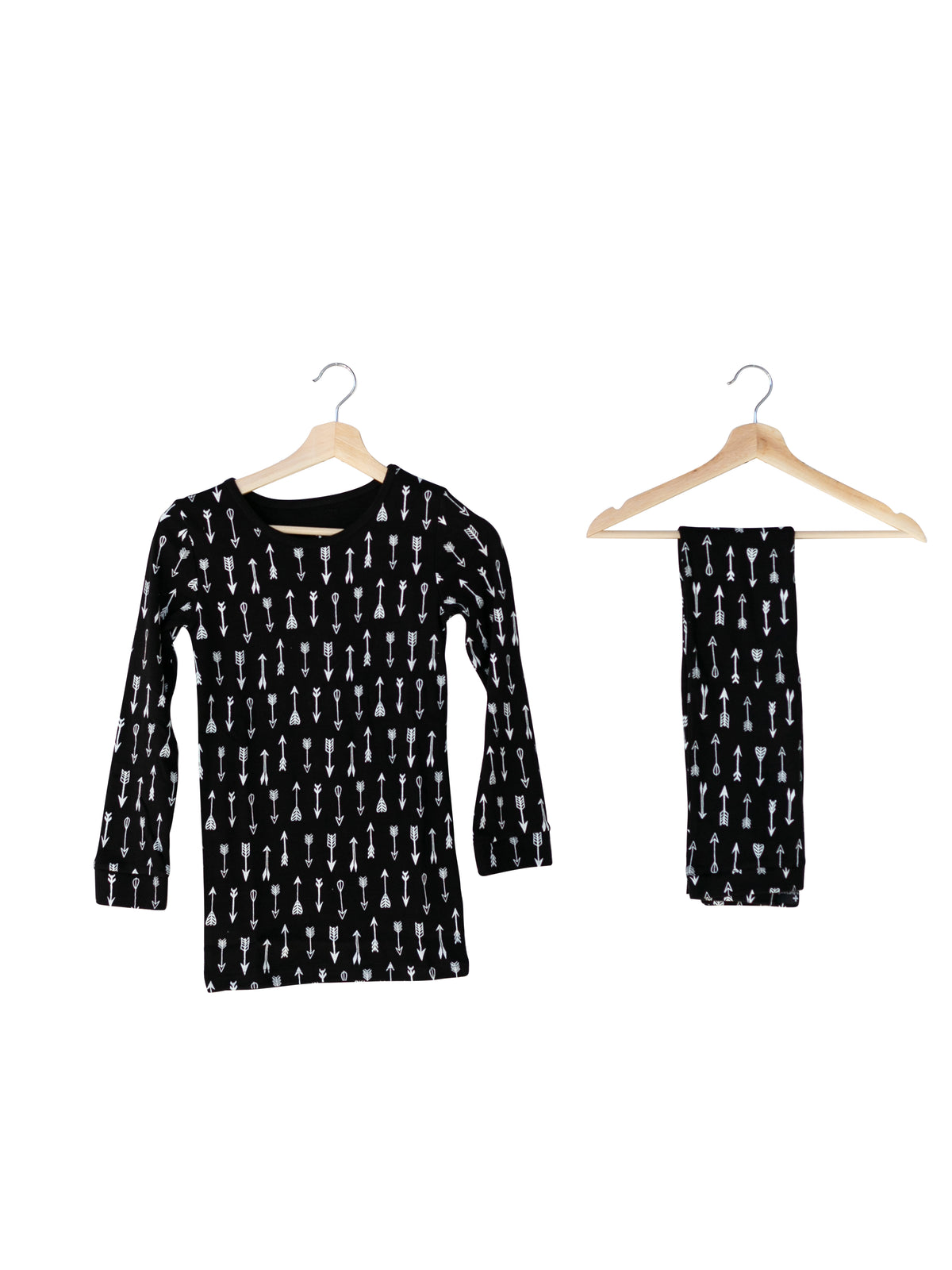 Organic Baby + Kids Pajama Set | White on Black Arrows — Printed pajama top and matching pants on hangers