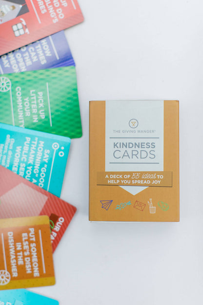 The Giving Manger Kindness Cards storage box with colorful kindness prompt cards.