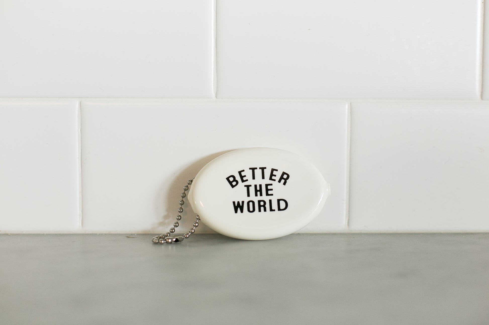 White vintage coin pouch for intentional giving by Modern Burlap