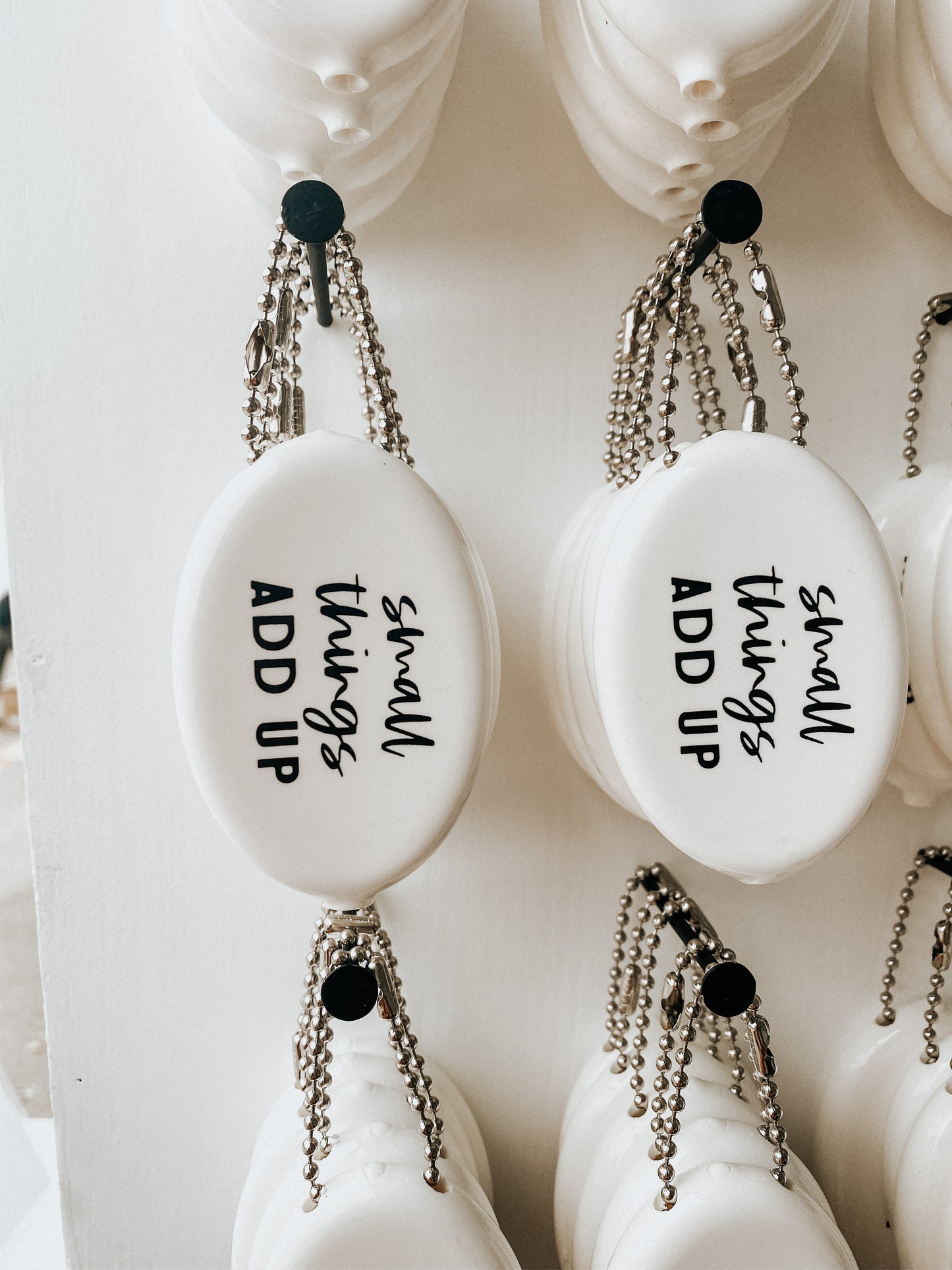 White vintage coin pouch for intentional giving by Modern Burlap