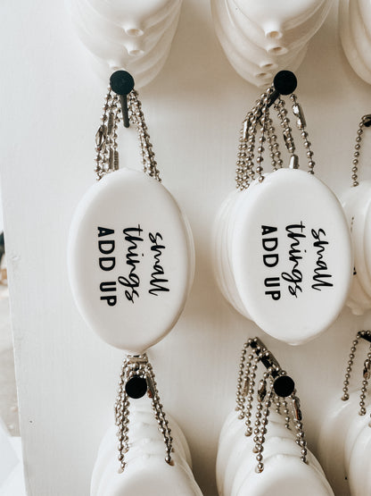 White vintage coin pouch for intentional giving by Modern Burlap