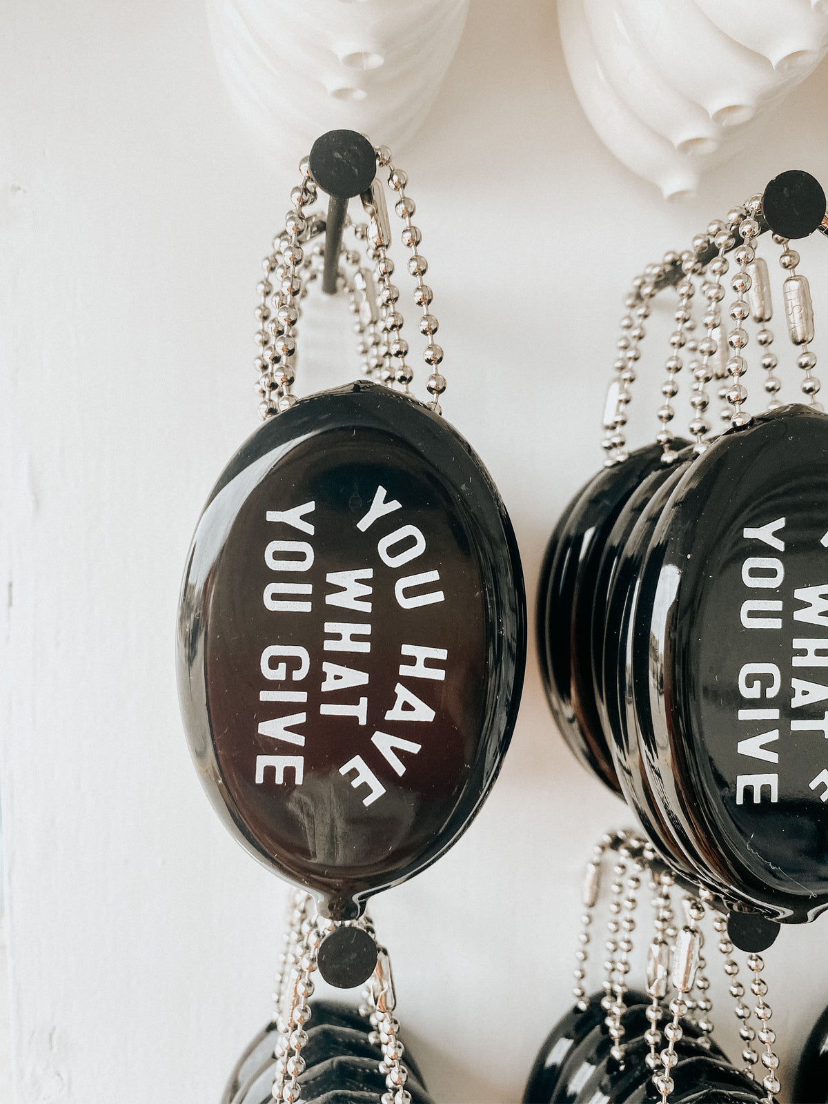 Black vintage coin pouch for intentional giving by Modern Burlap