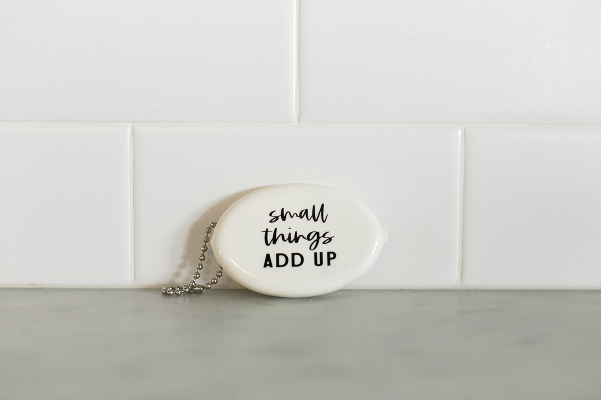 White vintage coin pouch for intentional giving by Modern Burlap