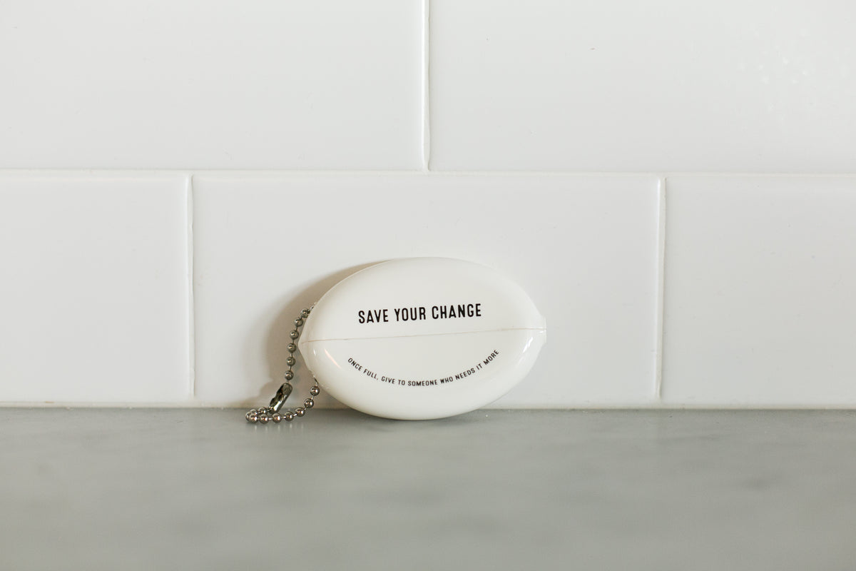 White vintage coin pouch for intentional giving by Modern Burlap
