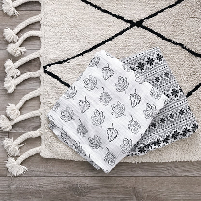 Styled product photograph of Fall Leaves Organic Swaddle.
