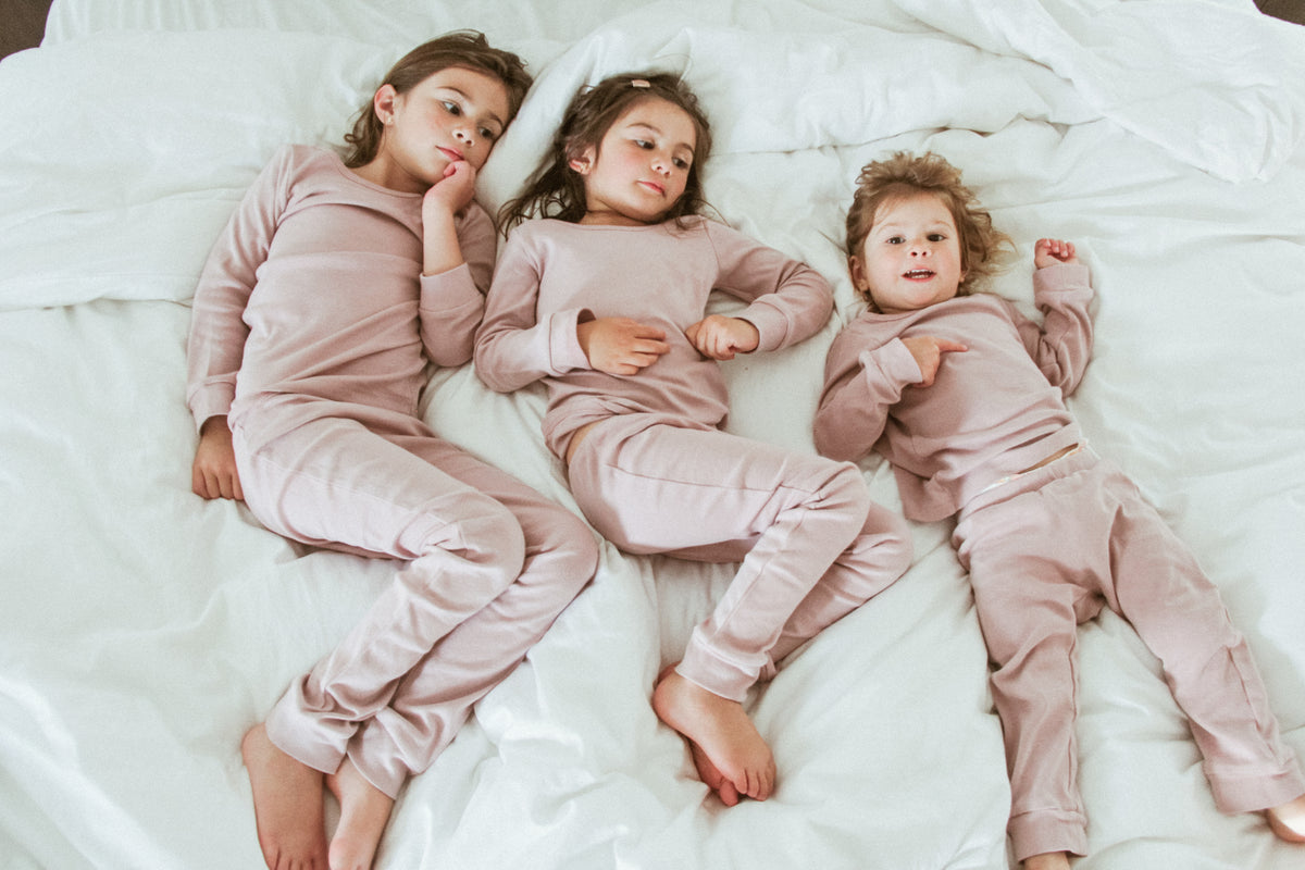 Organic Baby + Kids Pajama Set | Mauve — Children wearing matching mauve pajamas