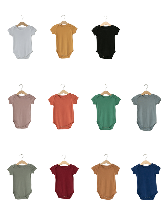 Solid color organic short sleeve baby bodysuit by Modern Burlap