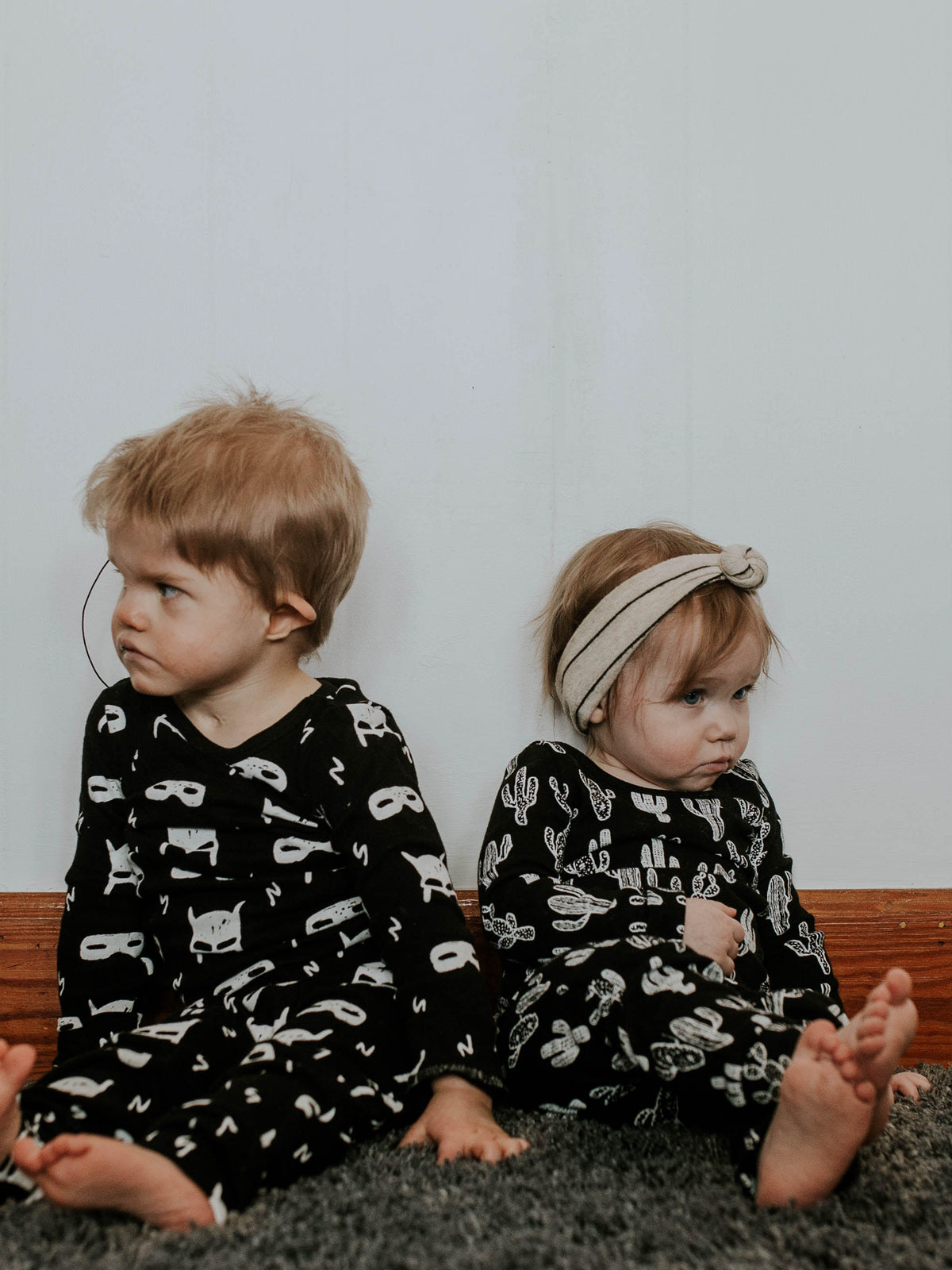 Organic Baby + Kids Pajama Set | White on Black Hero Struck — Children wearing coordinating black-and-white prints